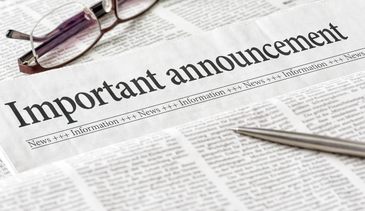 Newspaper with headline "Important Announcement"